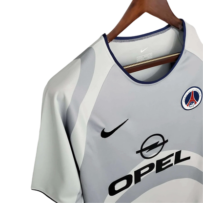 https://cdn.shopify.com/s/files/1/0826/7228/8075/files/20012002-paris-saint-germain-opel-away-grey-retro-jersey-557053.webp?v=1741198005