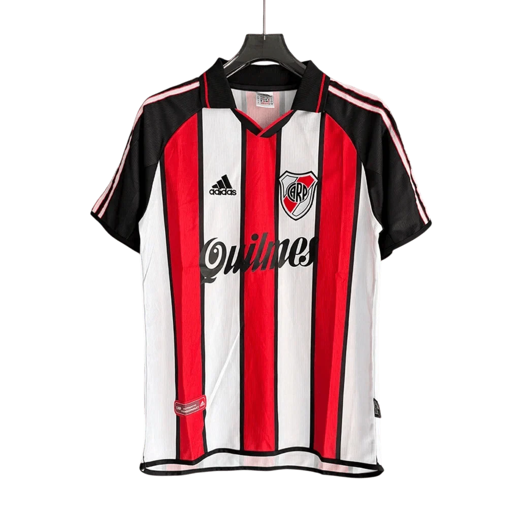 https://cdn.shopify.com/s/files/1/0826/7228/8075/files/20012002-river-plate-quilmes-away-retro-jersey-9853693.webp?v=1770038473