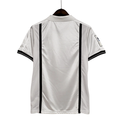 https://cdn.shopify.com/s/files/1/0826/7228/8075/files/20012002-valencia-terra-mitica-home-retro-kit-classickits433-197208.webp?v=1741199017