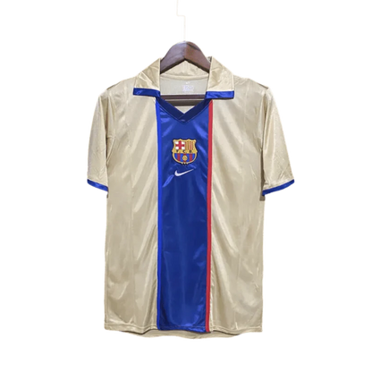 https://cdn.shopify.com/s/files/1/0826/7228/8075/files/20012003-fc-barcelona-away-retro-kit-128692.webp?v=1741197556