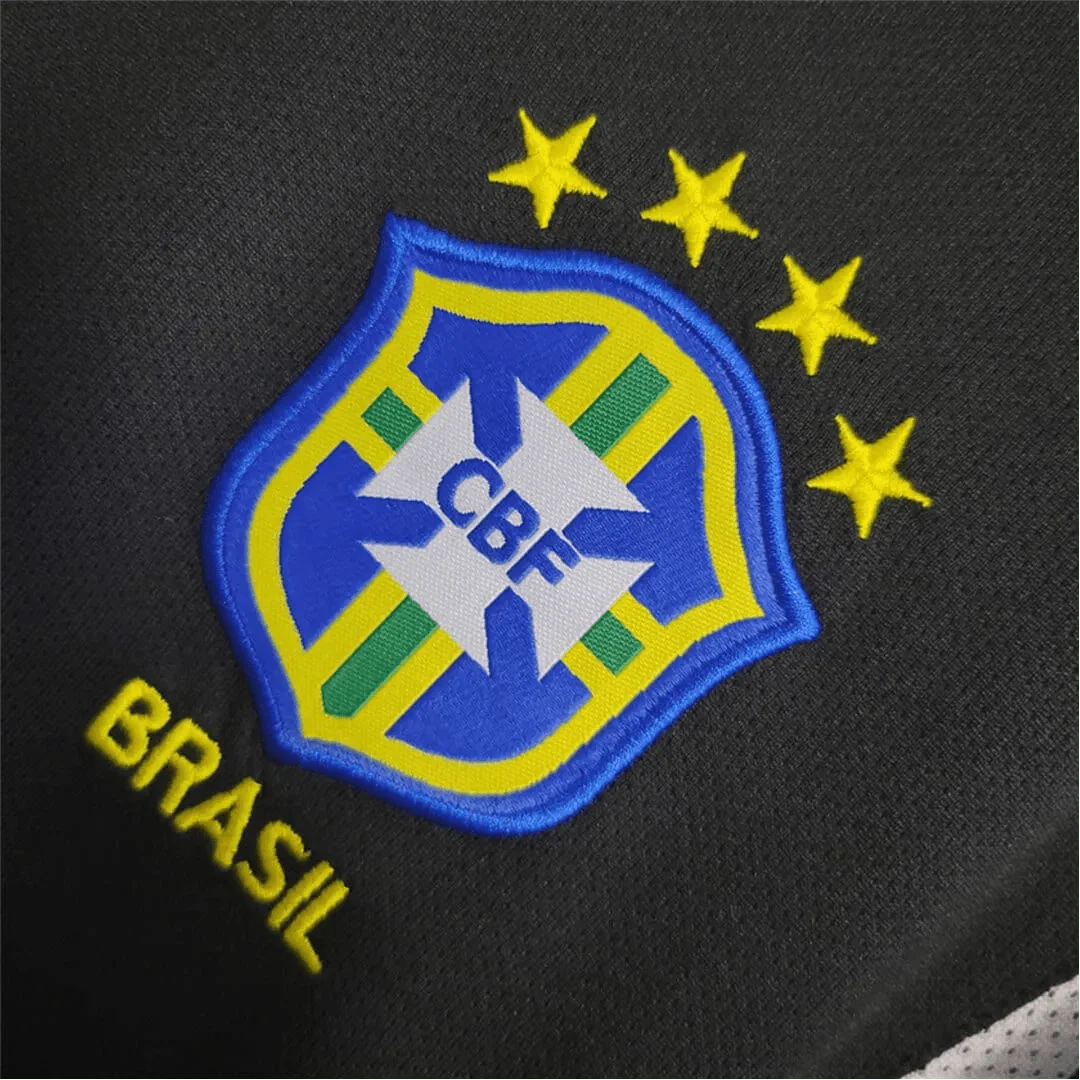 https://cdn.shopify.com/s/files/1/0826/7228/8075/files/2002-brazil-goalkeeper-dark-black-retro-kit-143981.webp?v=1741196946