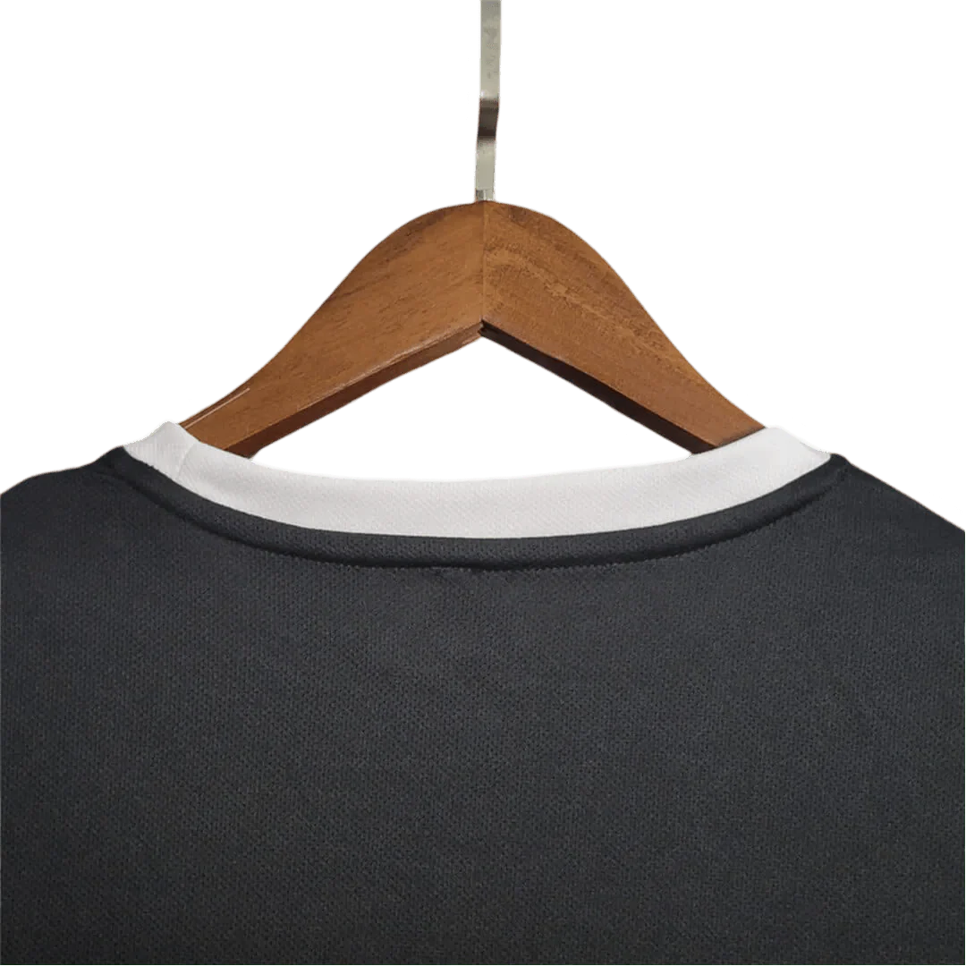 https://cdn.shopify.com/s/files/1/0826/7228/8075/files/2002-brazil-goalkeeper-dark-black-retro-kit-308654.webp?v=1741196944