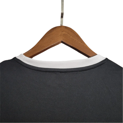 https://cdn.shopify.com/s/files/1/0826/7228/8075/files/2002-brazil-goalkeeper-dark-black-retro-kit-308654.webp?v=1741196944