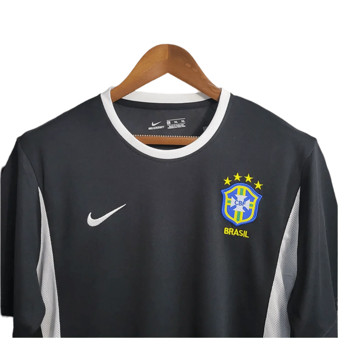 https://cdn.shopify.com/s/files/1/0826/7228/8075/files/2002-brazil-goalkeeper-dark-black-retro-kit-658406.webp?v=1741196947