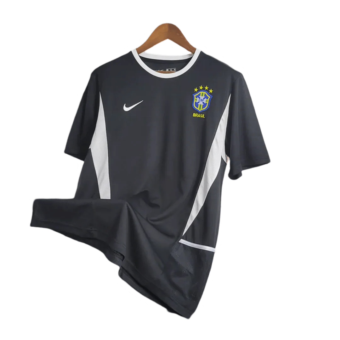 https://cdn.shopify.com/s/files/1/0826/7228/8075/files/2002-brazil-goalkeeper-dark-black-retro-kit-996411.webp?v=1741196945