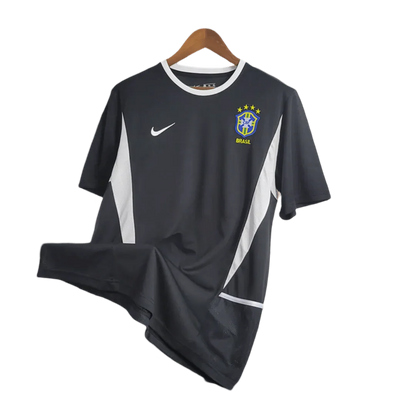 https://cdn.shopify.com/s/files/1/0826/7228/8075/files/2002-brazil-goalkeeper-dark-black-retro-kit-996411.webp?v=1741196945