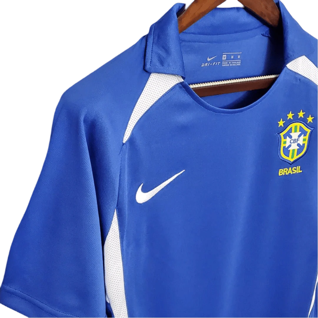 https://cdn.shopify.com/s/files/1/0826/7228/8075/files/2002-brazil-world-cup-away-retro-kit-classickits433-902750.webp?v=1741198761