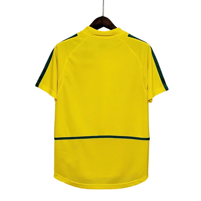 https://cdn.shopify.com/s/files/1/0826/7228/8075/files/2002-brazil-world-cup-home-retro-kit-classickits433-331500.webp?v=1741198809