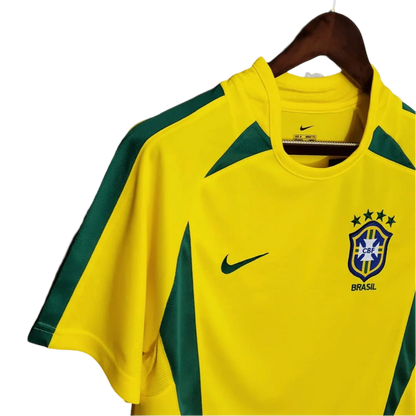 https://cdn.shopify.com/s/files/1/0826/7228/8075/files/2002-brazil-world-cup-home-retro-kit-classickits433-633755.webp?v=1741198810