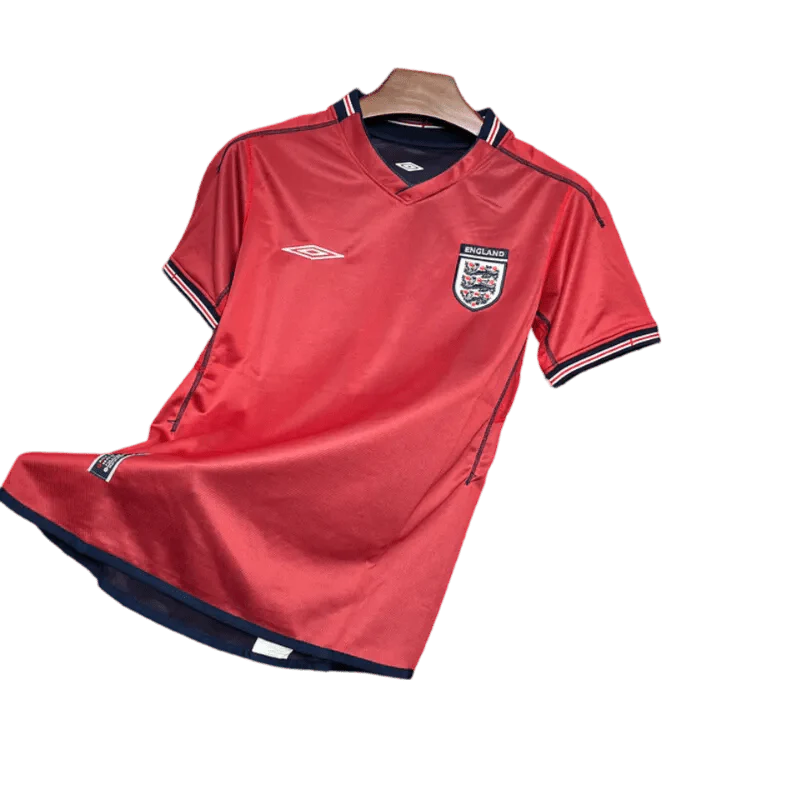 https://cdn.shopify.com/s/files/1/0826/7228/8075/files/2002-england-away-red-retro-kit-589282.webp?v=1741197033