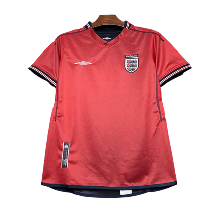 https://cdn.shopify.com/s/files/1/0826/7228/8075/files/2002-england-away-red-retro-kit-984341.webp?v=1741196953