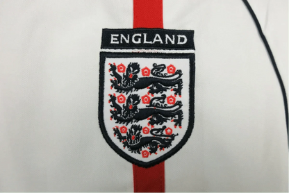 https://cdn.shopify.com/s/files/1/0826/7228/8075/files/2002-england-home-retro-kit-766267.webp?v=1741196944