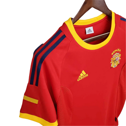 https://cdn.shopify.com/s/files/1/0826/7228/8075/files/2002-spain-home-red-retro-kit-339429.webp?v=1741197165