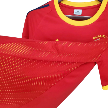 https://cdn.shopify.com/s/files/1/0826/7228/8075/files/2002-spain-home-red-retro-kit-755557.webp?v=1741197167