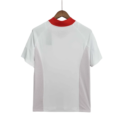 https://cdn.shopify.com/s/files/1/0826/7228/8075/files/20022003-ac-milan-for-peace-champions-league-final-edition-retro-kit-415965.webp?v=1741197275