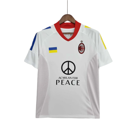 https://cdn.shopify.com/s/files/1/0826/7228/8075/files/20022003-ac-milan-for-peace-champions-league-final-edition-retro-kit-729501.webp?v=1741197276