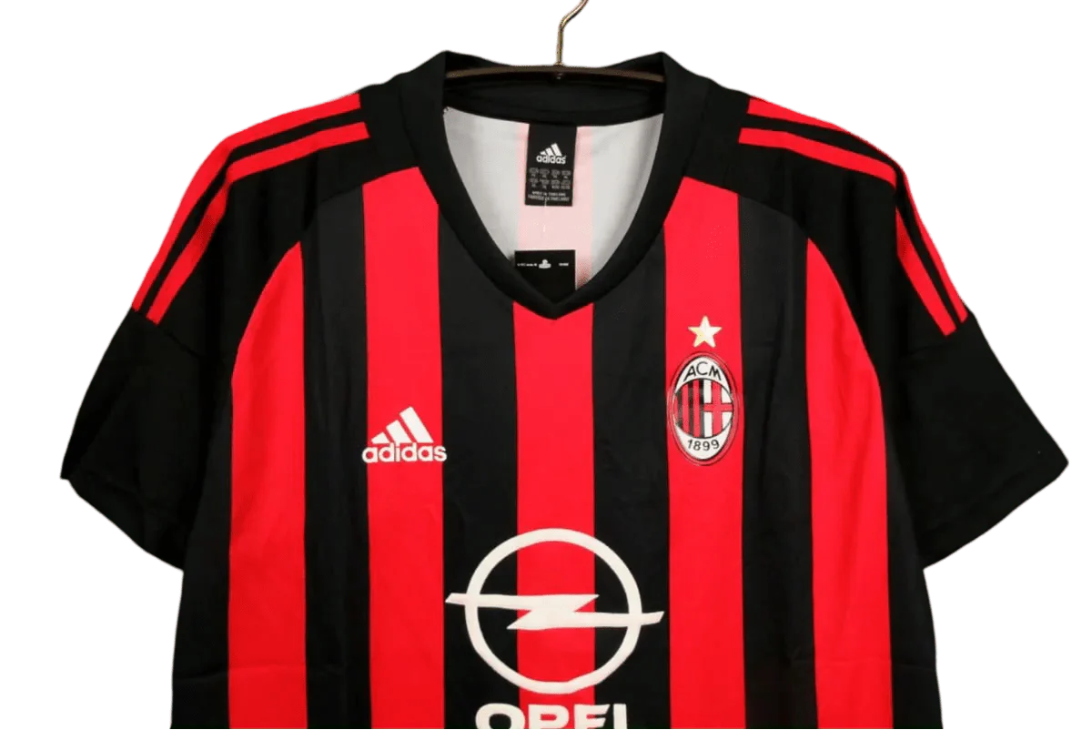 https://cdn.shopify.com/s/files/1/0826/7228/8075/files/20022003-ac-milan-opel-home-retro-kit-289519.webp?v=1741197288