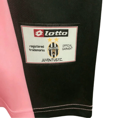 https://cdn.shopify.com/s/files/1/0826/7228/8075/files/20022003-juventus-tamoil-buffon-goalkeeper-pink-retro-kit-classickits433-930304.webp?v=1741198794