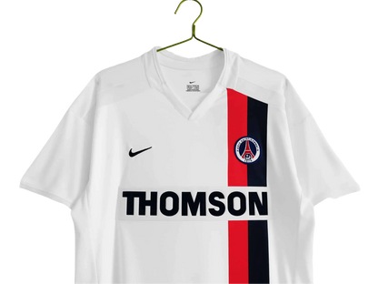 https://cdn.shopify.com/s/files/1/0826/7228/8075/files/20022003-paris-saint-germain-thomson-away-retro-kit-371603.webp?v=1741198003