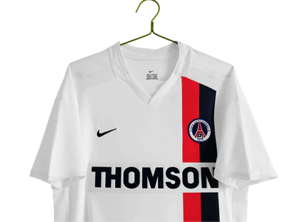 https://cdn.shopify.com/s/files/1/0826/7228/8075/files/20022003-paris-saint-germain-thomson-away-retro-kit-454973.webp?v=1741198003