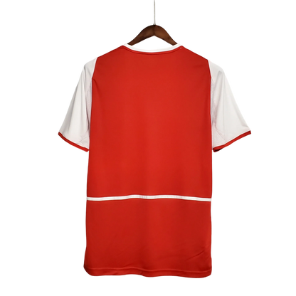 https://cdn.shopify.com/s/files/1/0826/7228/8075/files/20022004-arsenal-sponsor-o2-home-retro-kit-classickits433-193792.webp?v=1741198451