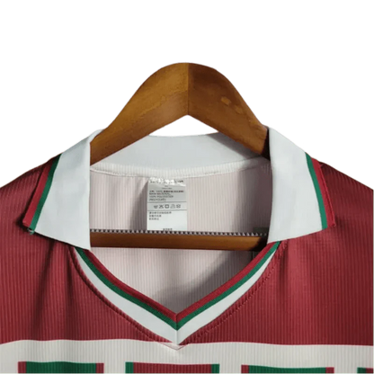 https://cdn.shopify.com/s/files/1/0826/7228/8075/files/2003-fluminense-unimed-home-retro-jersey-at-govintagejersey-236897.webp?v=1741197043