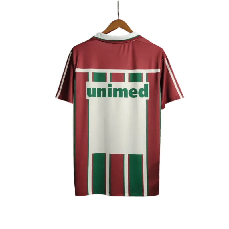 https://cdn.shopify.com/s/files/1/0826/7228/8075/files/2003-fluminense-unimed-home-retro-jersey-at-govintagejersey-819018.webp?v=1741197045