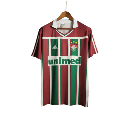 https://cdn.shopify.com/s/files/1/0826/7228/8075/files/2003-fluminense-unimed-home-retro-jersey-at-govintagejersey-860118.webp?v=1741197043