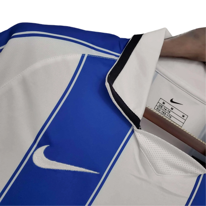 https://cdn.shopify.com/s/files/1/0826/7228/8075/files/20032004-fc-porto-revigres-home-retro-jersey-266379.webp?v=1741198250