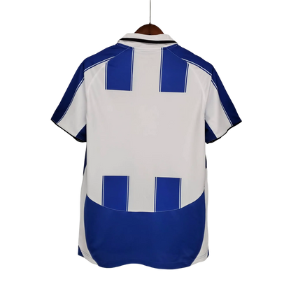 https://cdn.shopify.com/s/files/1/0826/7228/8075/files/20032004-fc-porto-revigres-home-retro-jersey-505940.webp?v=1741198248
