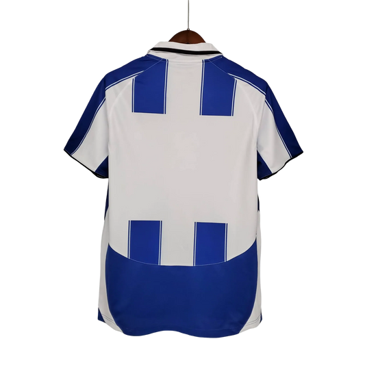https://cdn.shopify.com/s/files/1/0826/7228/8075/files/20032004-fc-porto-revigres-home-retro-jersey-505940.webp?v=1741198248