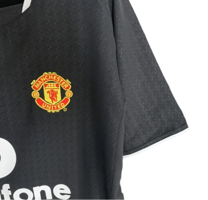 https://cdn.shopify.com/s/files/1/0826/7228/8075/files/20032004-manchester-united-vodafone-black-away-retro-kit-classickits433-555369.webp?v=1741199139