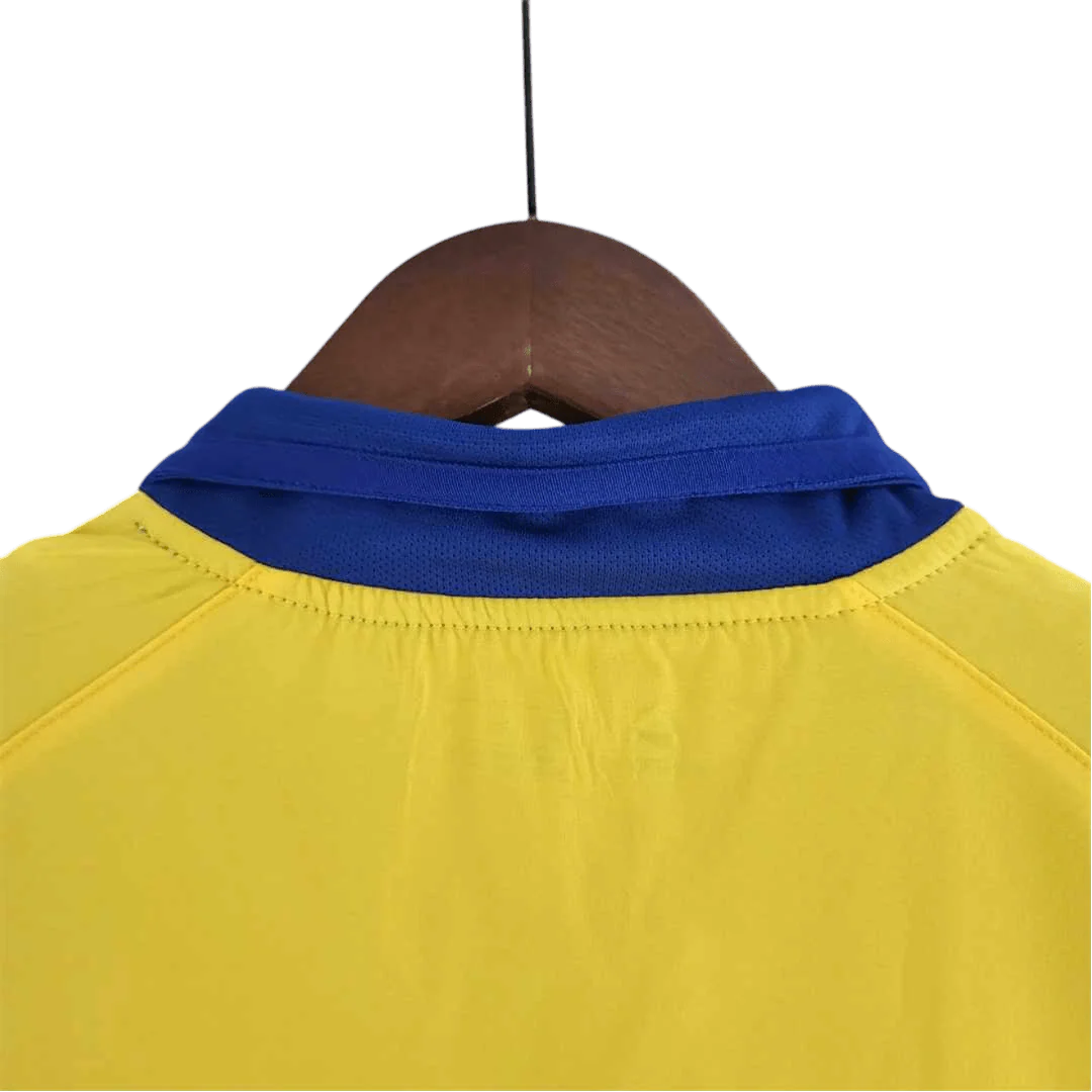 https://cdn.shopify.com/s/files/1/0826/7228/8075/files/20032005-arsenal-sponsor-o2-yellow-away-retro-kit-classickits433-366072.webp?v=1741199349