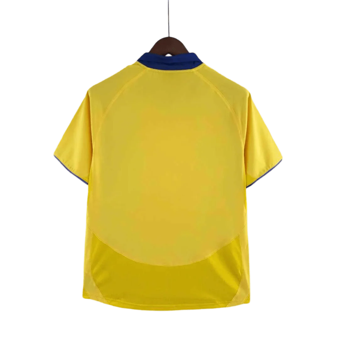 https://cdn.shopify.com/s/files/1/0826/7228/8075/files/20032005-arsenal-sponsor-o2-yellow-away-retro-kit-classickits433-779656.webp?v=1741199345