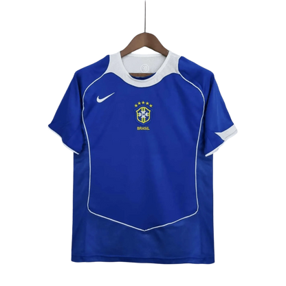 https://cdn.shopify.com/s/files/1/0826/7228/8075/files/2004-brazil-away-retro-kit-636341.webp?v=1741196949