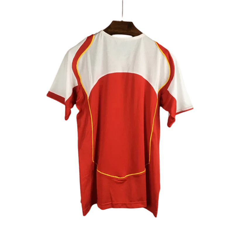 https://cdn.shopify.com/s/files/1/0826/7228/8075/files/20042005-arsenal-sponsor-o2-home-retro-kit-classickits433-952298.webp?v=1741199350