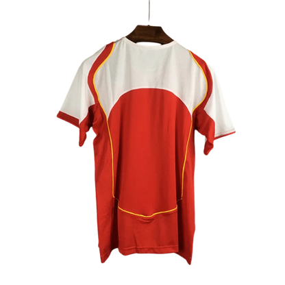 https://cdn.shopify.com/s/files/1/0826/7228/8075/files/20042005-arsenal-sponsor-o2-home-retro-kit-classickits433-952298.webp?v=1741199350