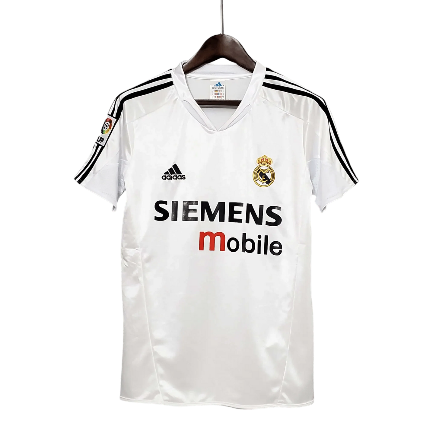 https://cdn.shopify.com/s/files/1/0826/7228/8075/files/20042005-real-madrid-siemens-mobile-home-retro-kit-736239.webp?v=1741197482