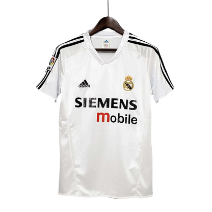 https://cdn.shopify.com/s/files/1/0826/7228/8075/files/20042005-real-madrid-siemens-mobile-home-retro-kit-736239.webp?v=1741197482