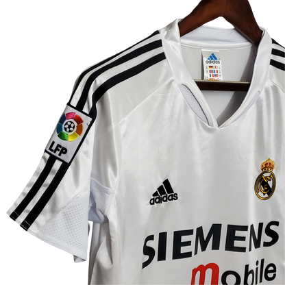 https://cdn.shopify.com/s/files/1/0826/7228/8075/files/20042005-real-madrid-siemens-mobile-home-retro-kit-754169.webp?v=1741197482
