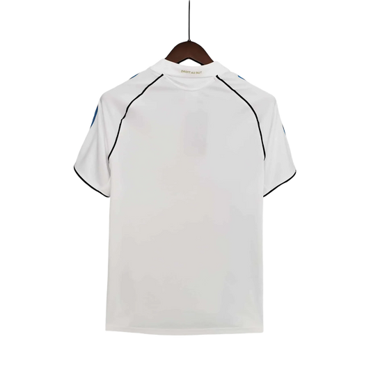 https://cdn.shopify.com/s/files/1/0826/7228/8075/files/20052006-olympique-de-marseille-n9uf-telecom-home-retro-jersey-159357.webp?v=1741198008