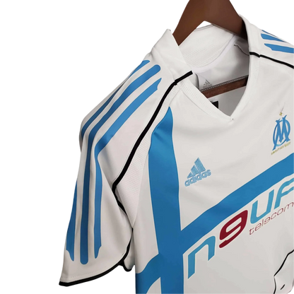 https://cdn.shopify.com/s/files/1/0826/7228/8075/files/20052006-olympique-de-marseille-n9uf-telecom-home-retro-jersey-432812.webp?v=1741198011