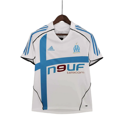 https://cdn.shopify.com/s/files/1/0826/7228/8075/files/20052006-olympique-de-marseille-n9uf-telecom-home-retro-jersey-487415.webp?v=1741198013