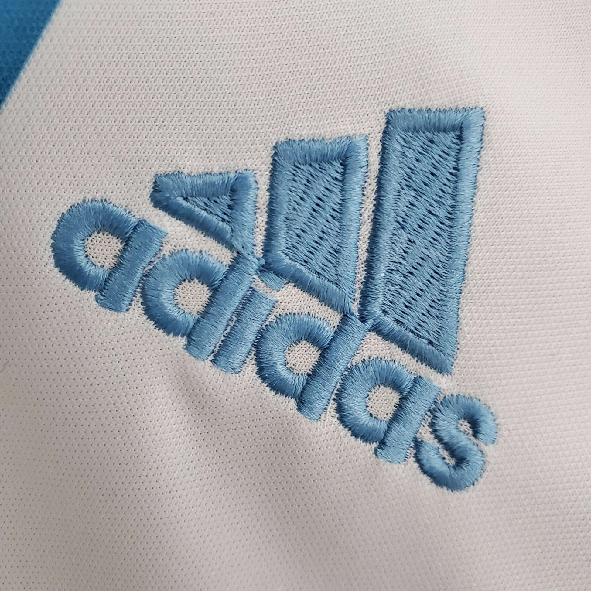 https://cdn.shopify.com/s/files/1/0826/7228/8075/files/20052006-olympique-de-marseille-n9uf-telecom-home-retro-jersey-664999.webp?v=1741198013