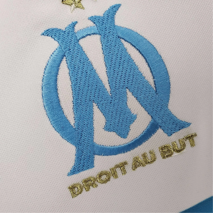 https://cdn.shopify.com/s/files/1/0826/7228/8075/files/20052006-olympique-de-marseille-n9uf-telecom-home-retro-jersey-842265.webp?v=1741198010