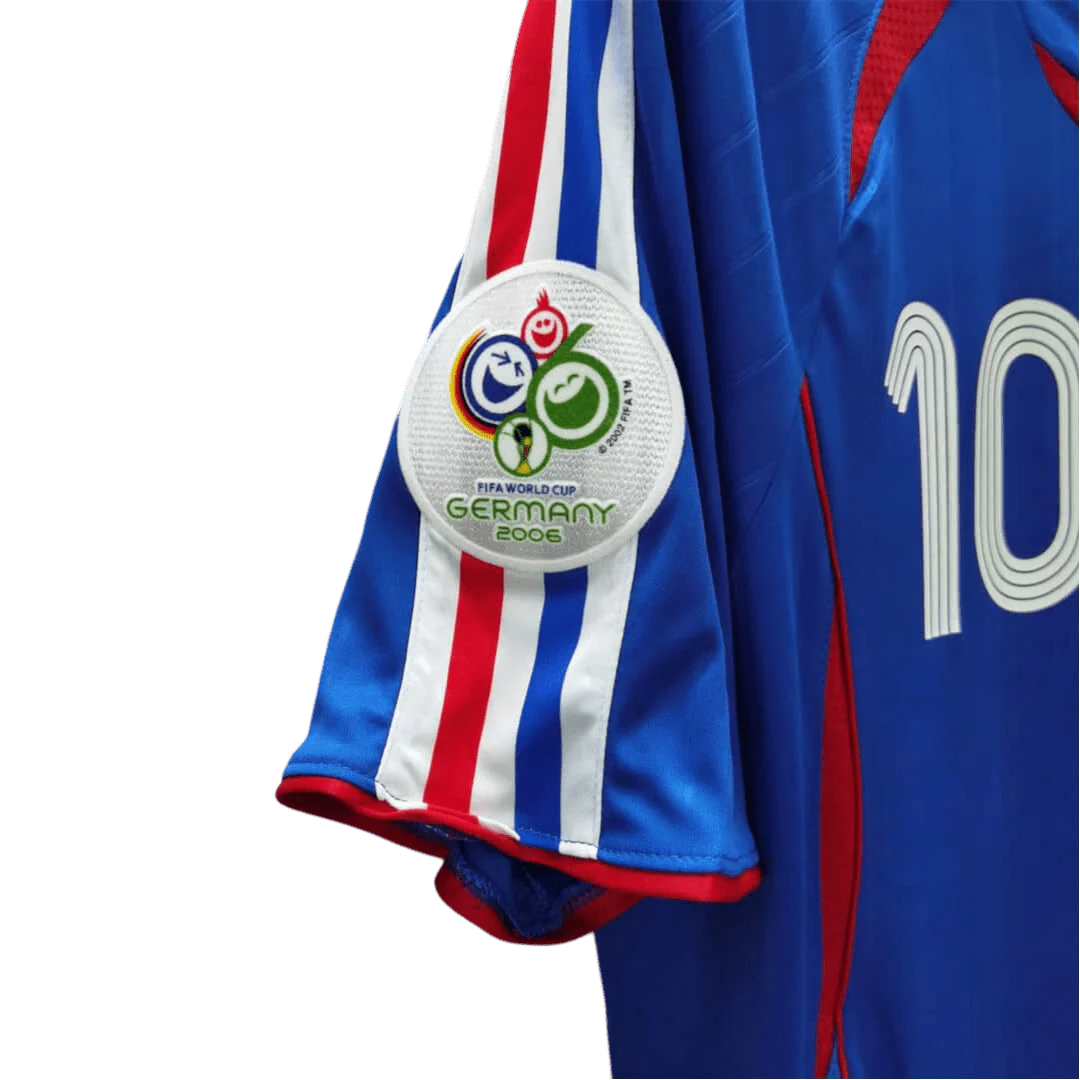 https://cdn.shopify.com/s/files/1/0826/7228/8075/files/2006-france-world-cup-home-retro-jersey-730124.webp?v=1741198512