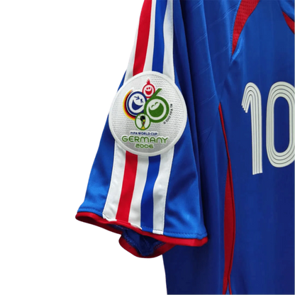 https://cdn.shopify.com/s/files/1/0826/7228/8075/files/2006-france-world-cup-home-retro-jersey-730124.webp?v=1741198512