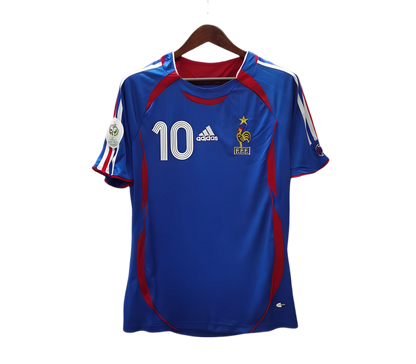 https://cdn.shopify.com/s/files/1/0826/7228/8075/files/2006-france-world-cup-home-retro-jersey-861077.webp?v=1741198515