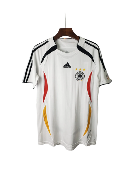 https://cdn.shopify.com/s/files/1/0826/7228/8075/files/2006-germany-world-cup-retro-kit-330042.webp?v=1741197027