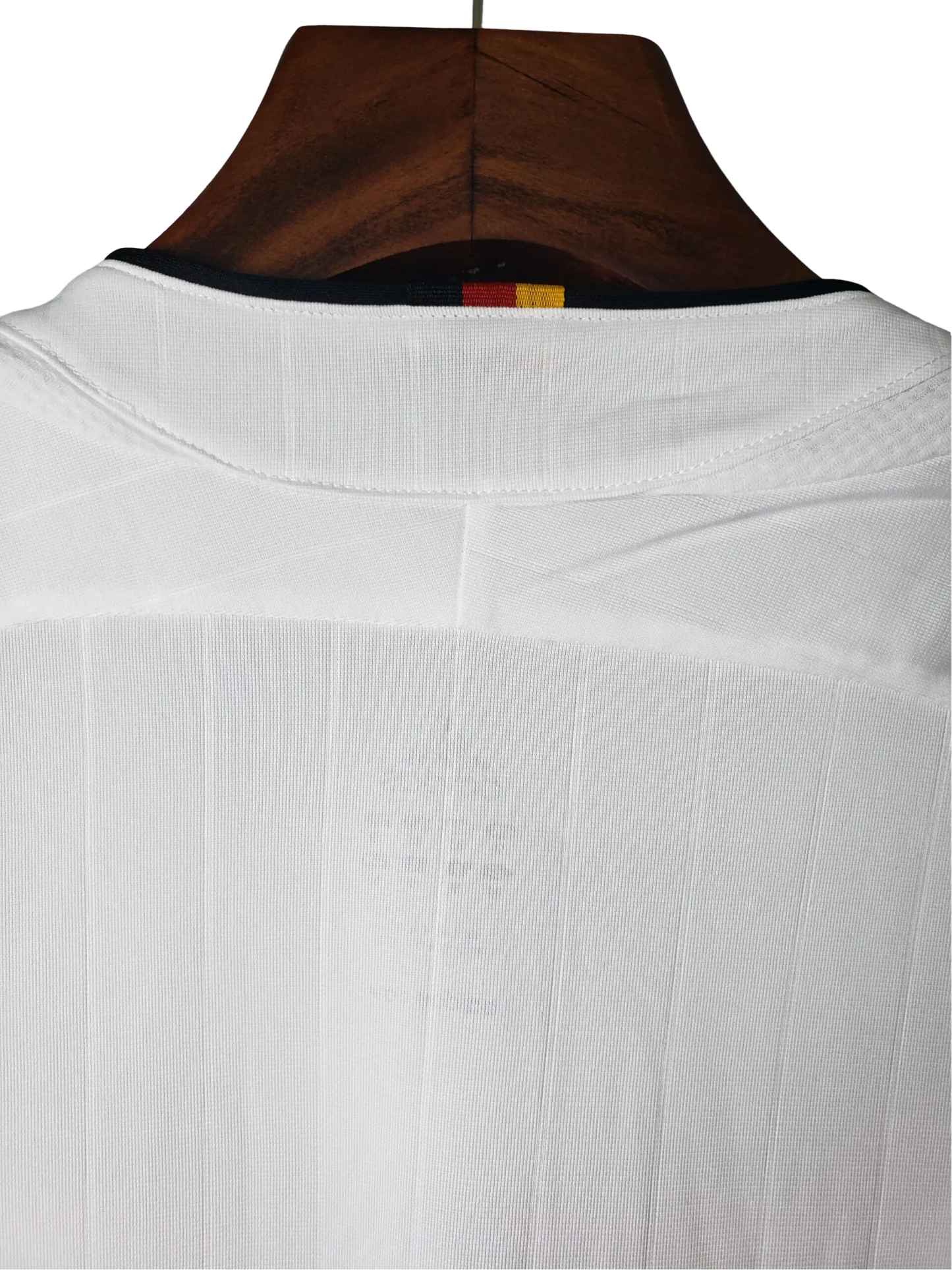 https://cdn.shopify.com/s/files/1/0826/7228/8075/files/2006-germany-world-cup-retro-kit-821318.webp?v=1741197028